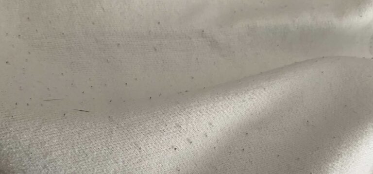 how to remove white fuzz from a hoodie