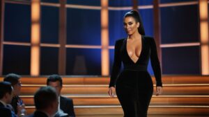 Default Kim Kardashian walks onto the stage at the Tom Brady r